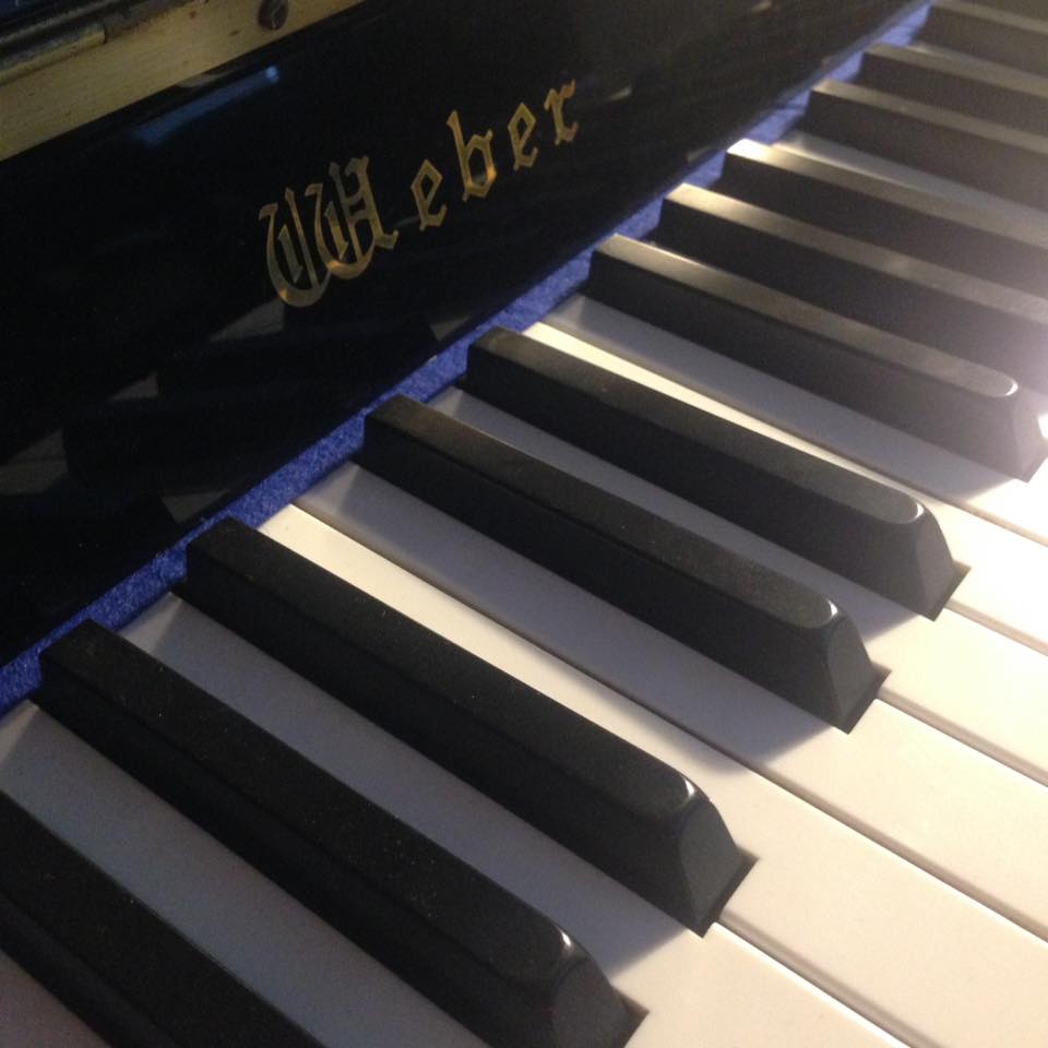 Weber black upright piano